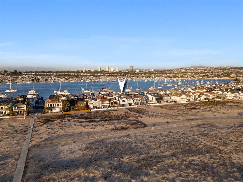 Aerial view of the beach with home pinpoint