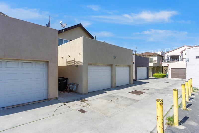 Alley view of garage parking