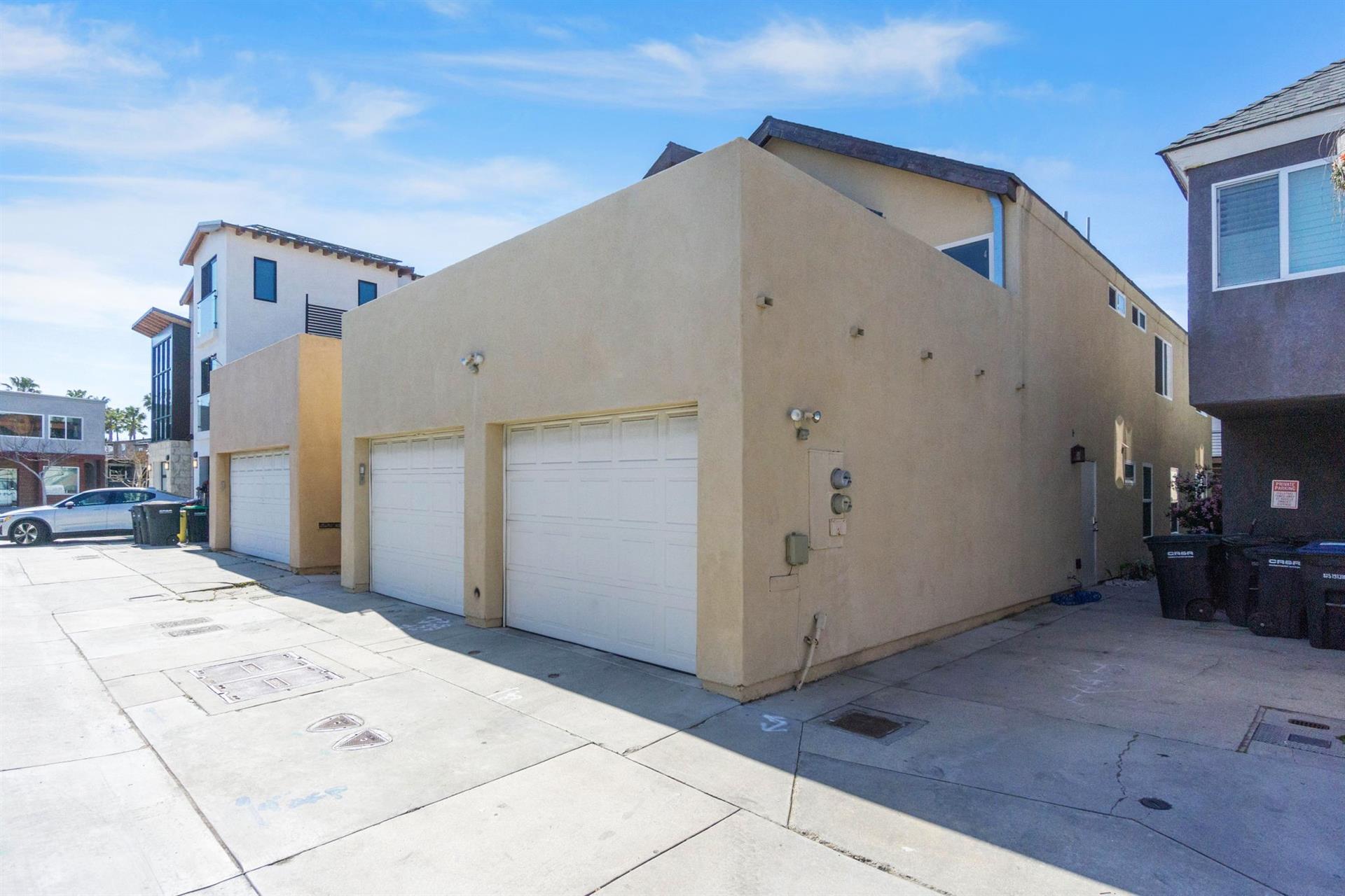 Alley view of garage parking
