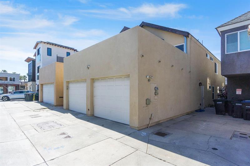 Alley view of garage parking