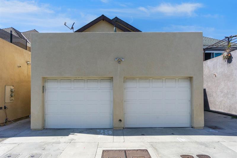 Alley view of garage parking