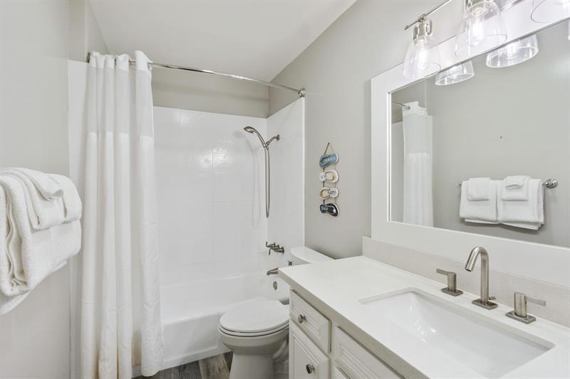 Ensuite secondary bathroom with private shower and tub
