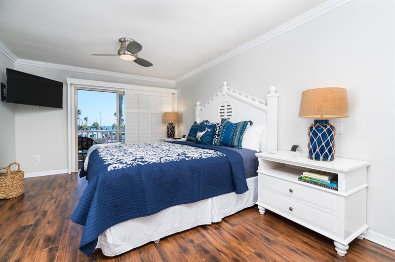 Master bedroom with TV, ocean views and en suite bath