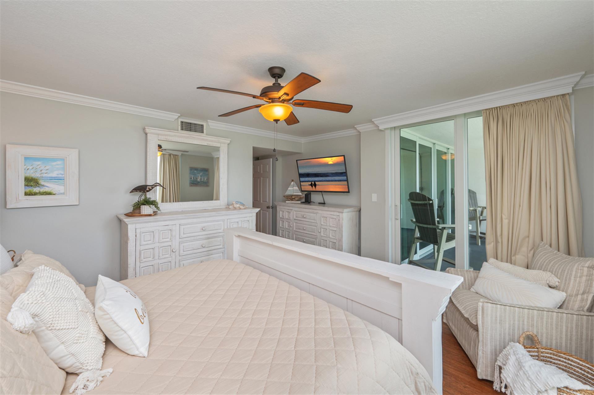 Primary bedroom with access to balcony