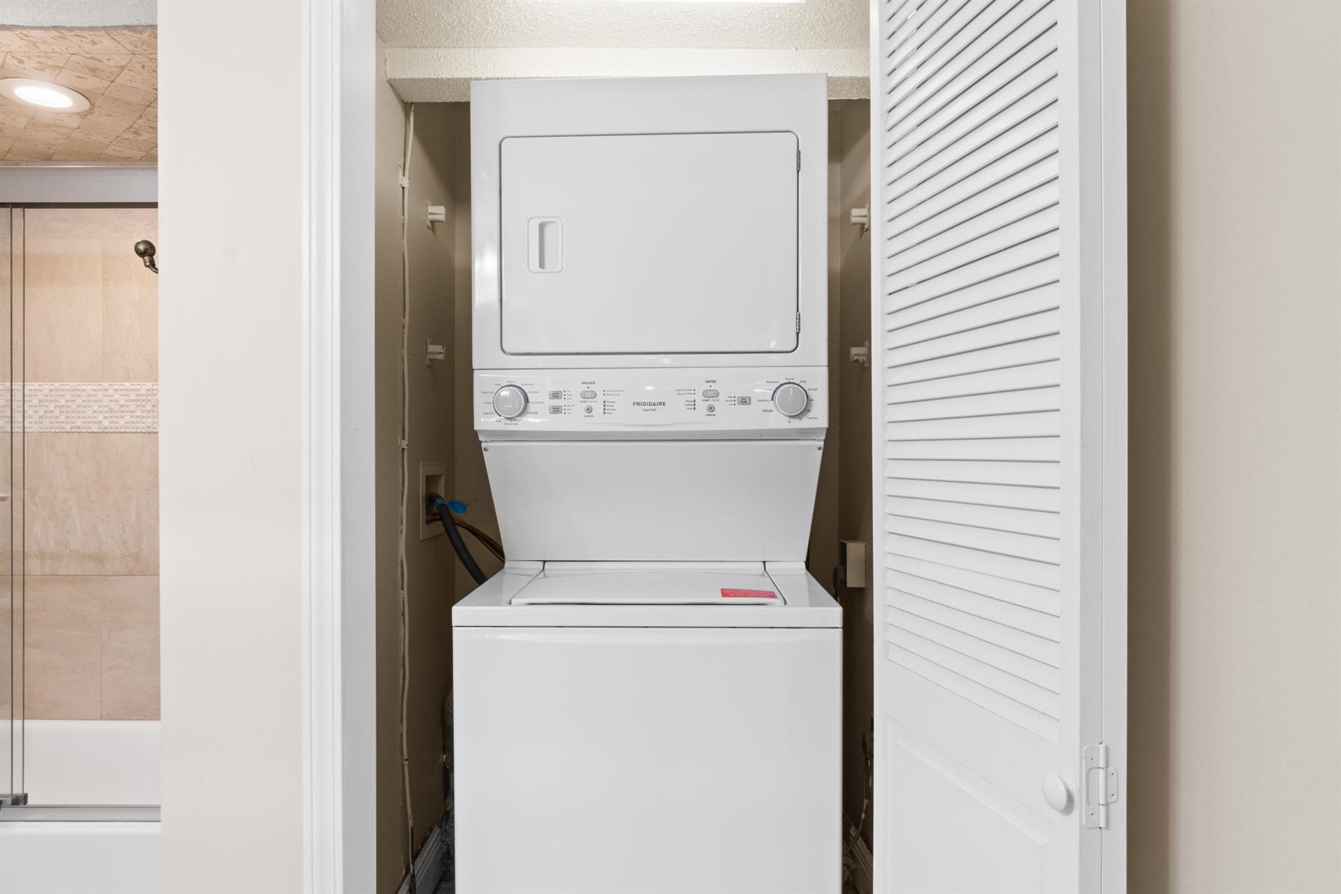 Laundry closet in guest bath