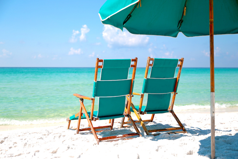 Beach chairs on the white sand of Destin