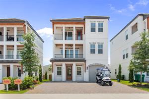Gorgeous, Clean Exterior with 2 Balconies and 6 Passenger Golf Cart.