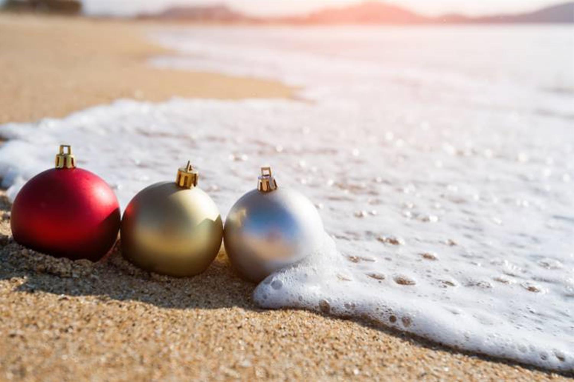 christmas ornaments on beach