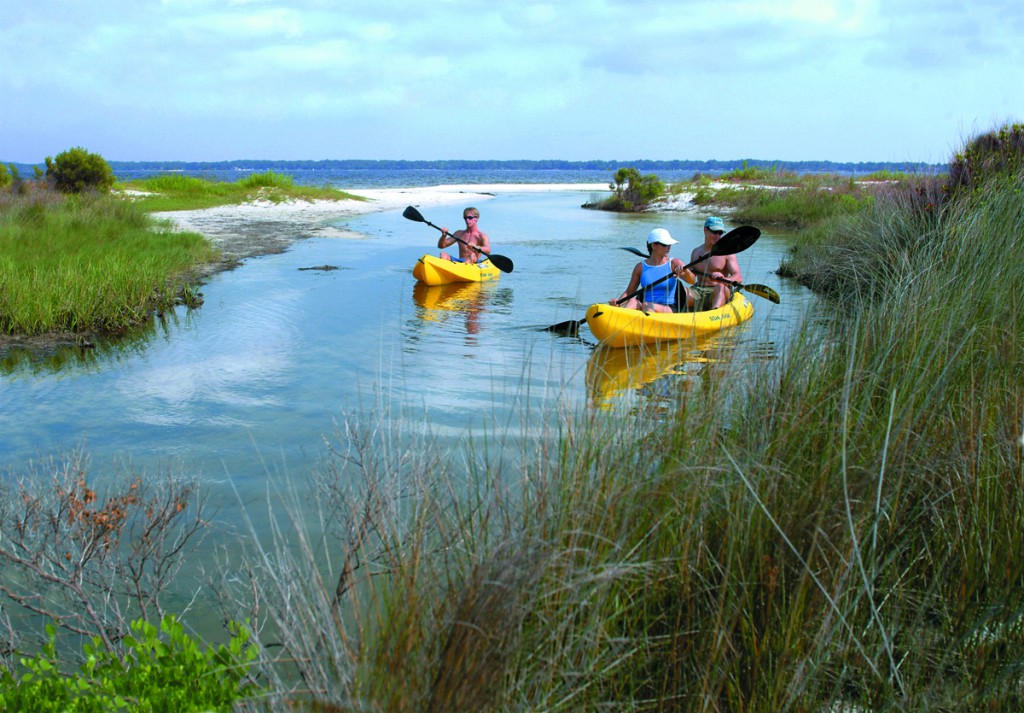 Tourists kayaking in Pensacola Beach Florida