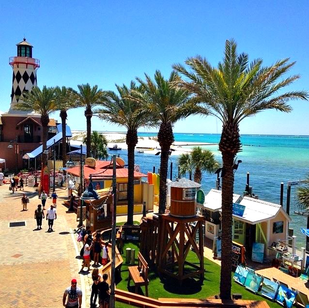 HarborWalk Village Destin street scene with Harry T's Lighthouse and harbor view