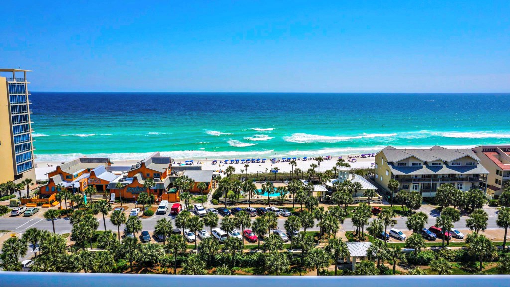 Gulf view with condos, roadways, and trees at Panama City Beach