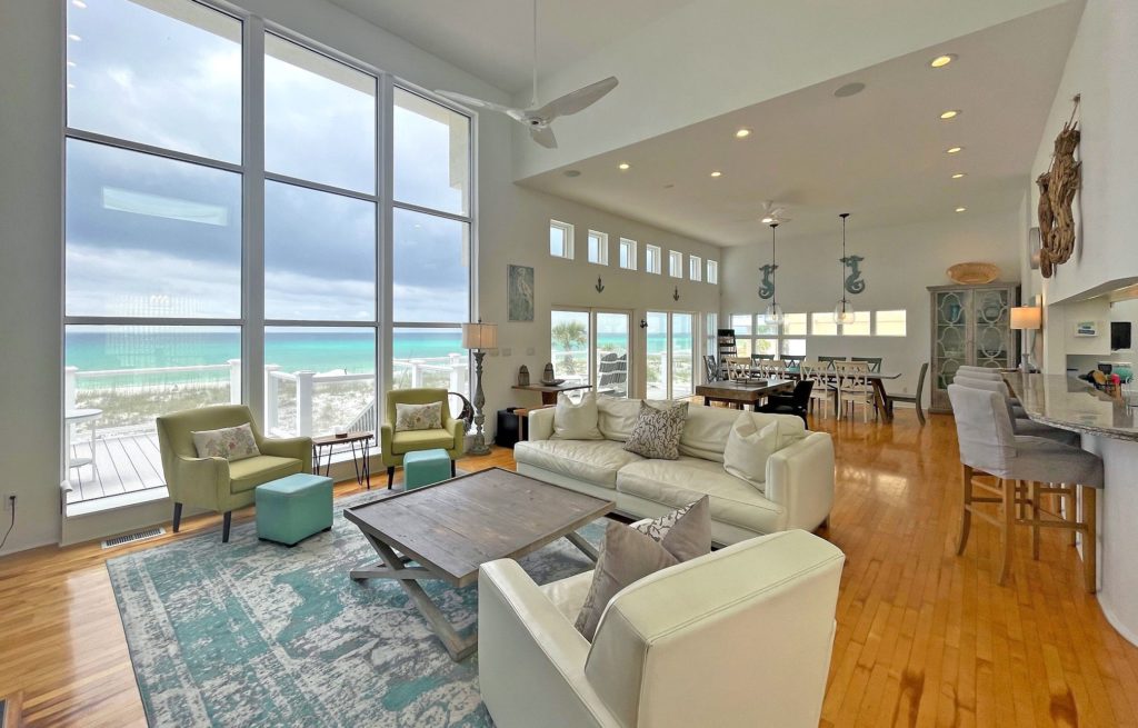 Ariola 310 beach house's den with floor-to-ceiling windows.