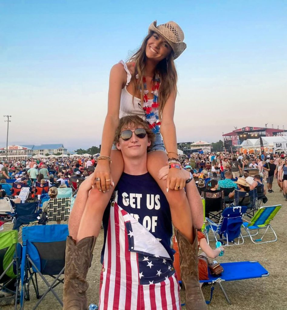 A girl on a boy's shoulders partying at a previous Gulf Coast Jam.