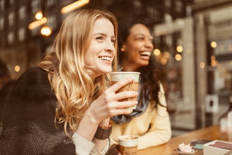 Happy lady drinking coffee