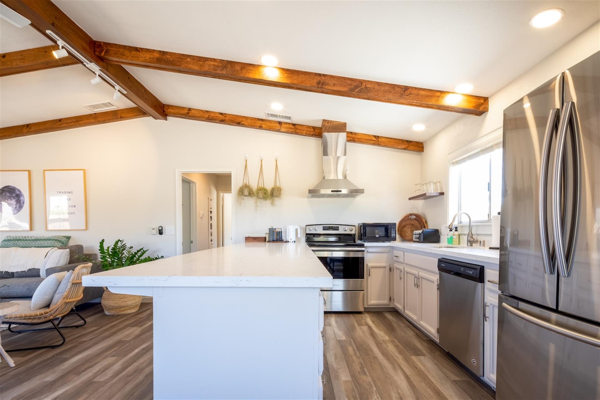 Spacious kitchen with a 12 counter top on one side. Great for gathering with family and friends over food. Kitchen is fully stocked with potspansutensilsessential tools and spices. Tea and local J