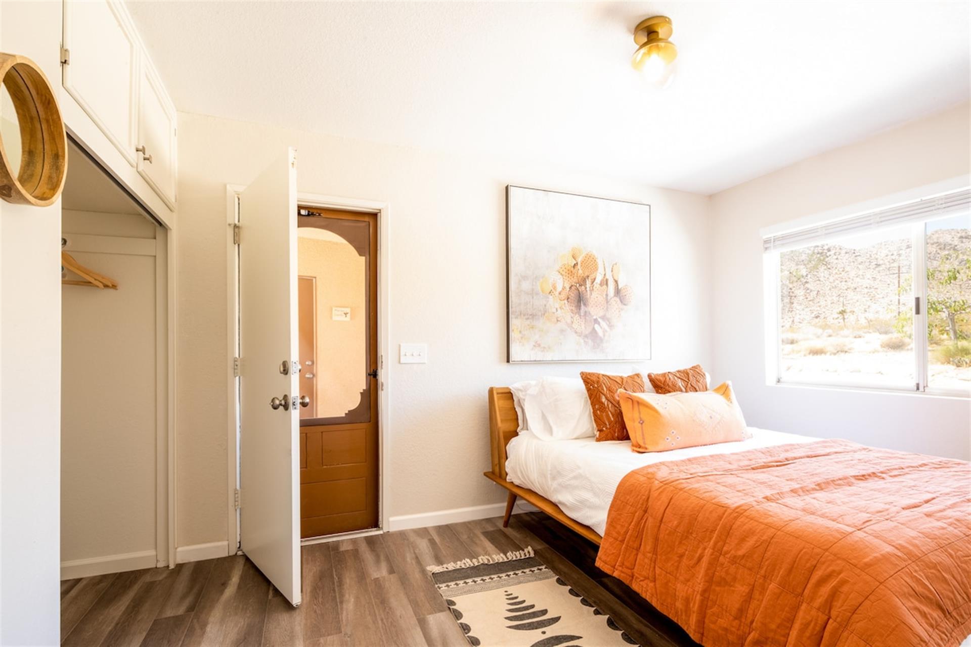 Queen size bed, organic cotton linens in the smaller bedroom. Two terrycloth robes and plenty of closet space.
