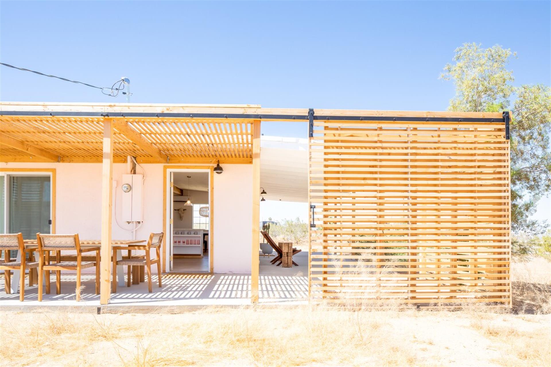 Side Porch with pergola and sliding shade screen