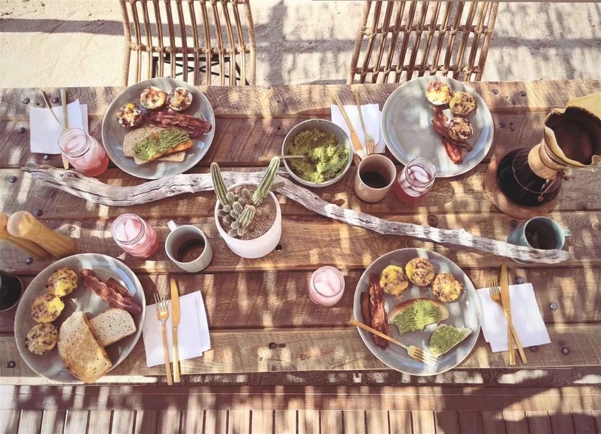 Eat al fresco at the handmade dining table under the pergola  a sunny breakfast or dinner under the stars