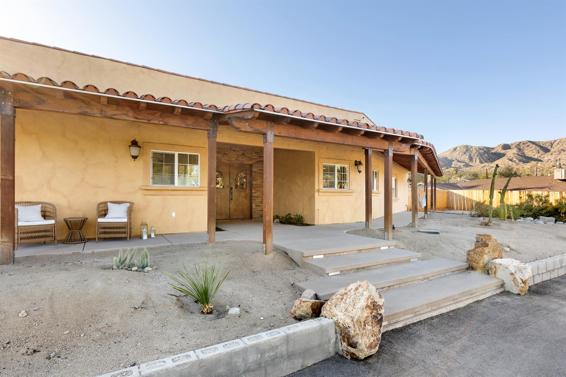 Casa Amarilla peeking out behind its serene desert landscape