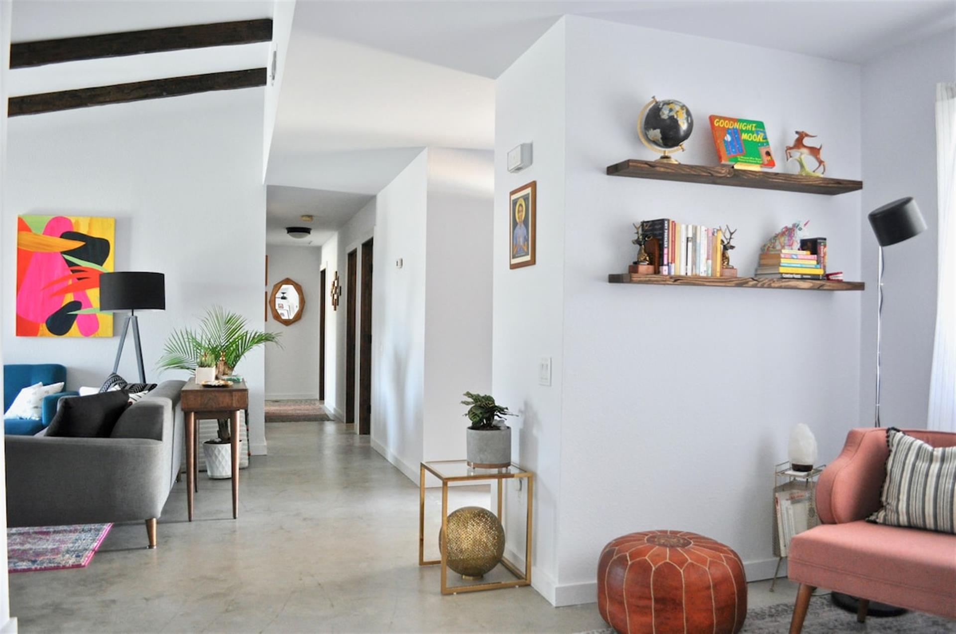 Living Room and Nook are at the center of the house with the bedrooms  bathrooms on one end and the kitchen  dining room on the other end.