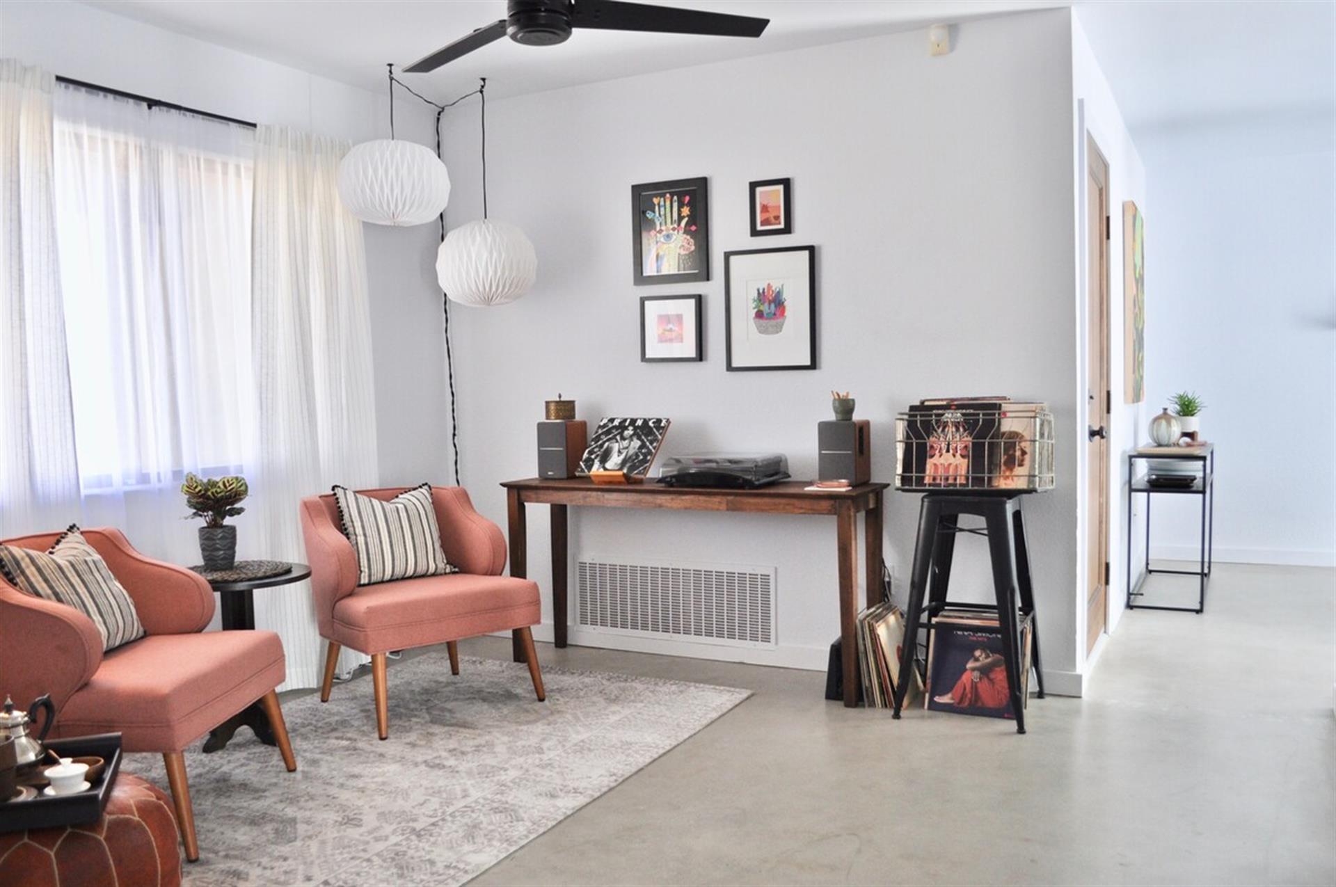 The nook is between the living room and dining room and kitchen. The window faces the front of the house.