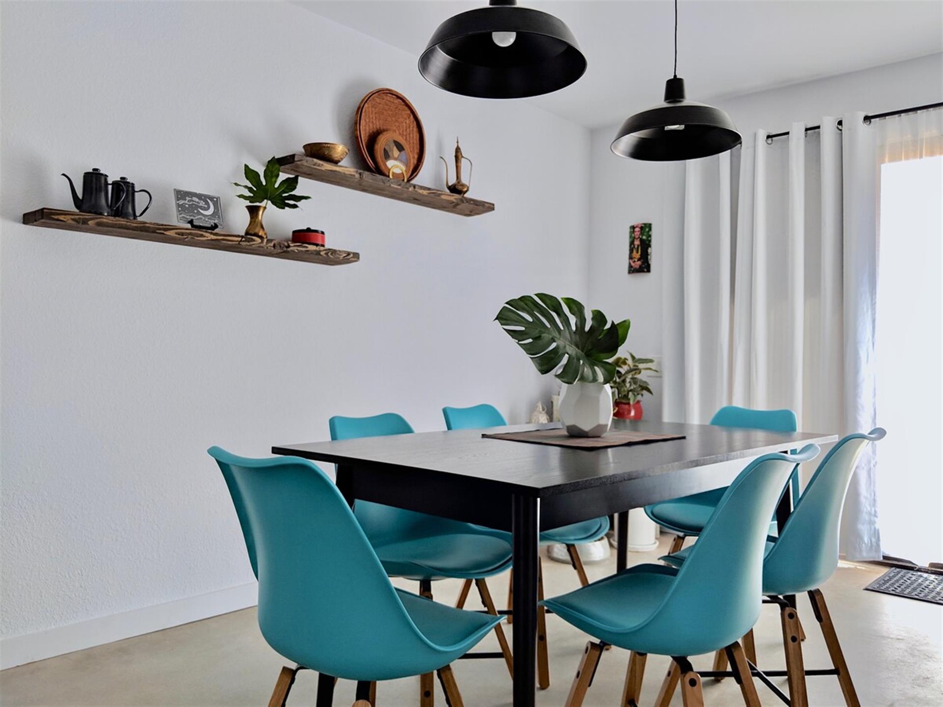 Dining Room with sliding glass doors to backyard. Currently we have only a seating area for 2 on the patio. More coming Summer 2019.