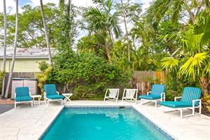 Pool features lush tropical surroundings for extra privacy.