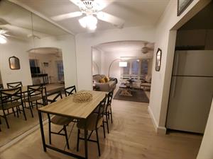 The kitchen is easily accessible to the dining room.