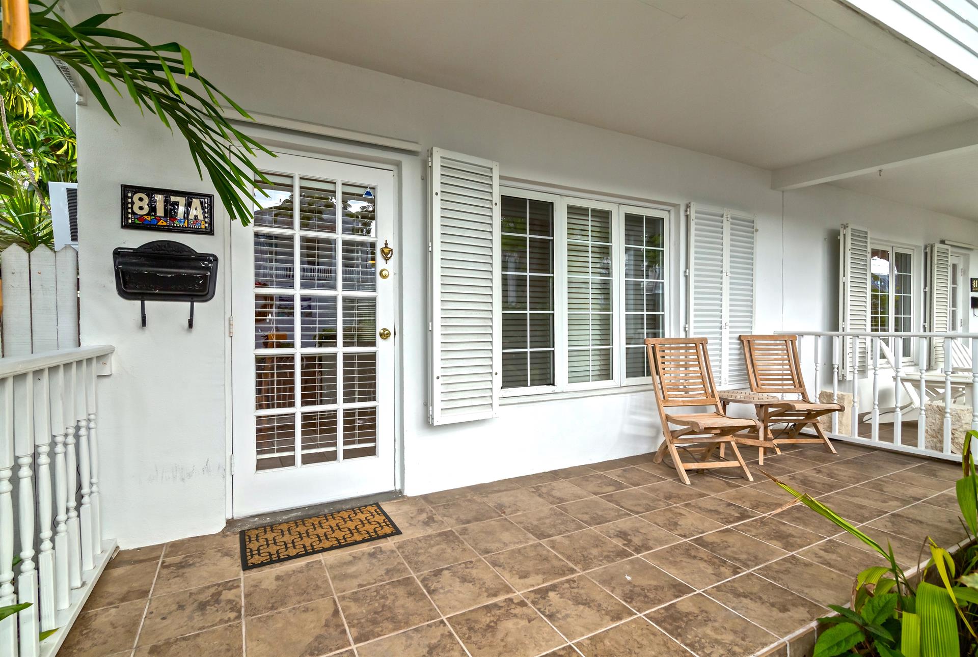 The front porch of this Key West cutie is perfect for relaxing.