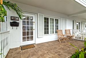 The front porch of this Key West cutie is perfect for relaxing.