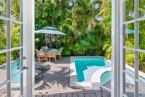 The living area spills onto the deck with private cocktail pool.
