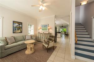 Stairs lead to 2 queen ensuite bedrooms.
