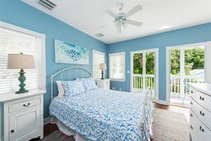 Queen bedroom with balcony access.