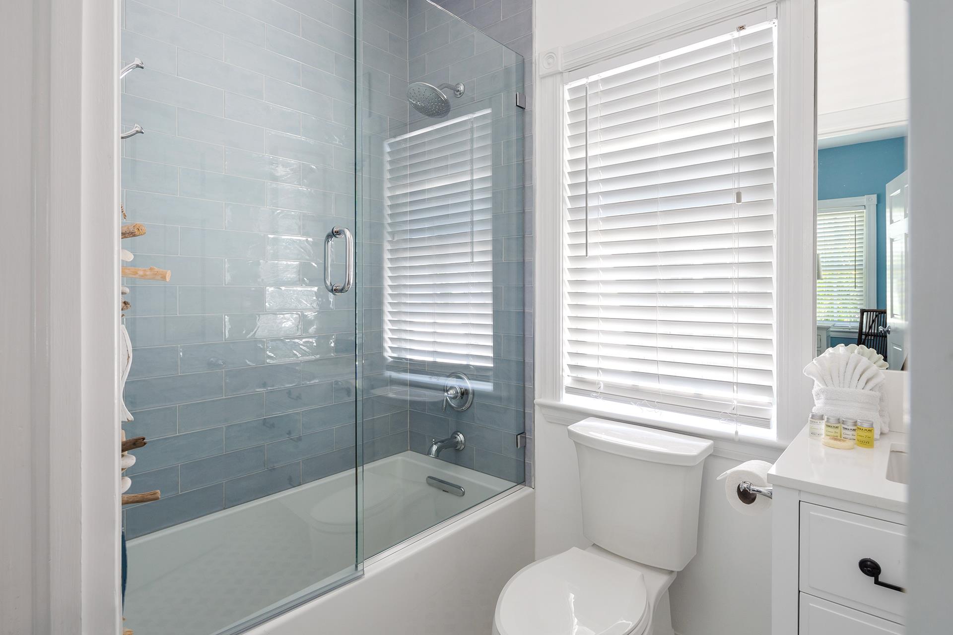 Elegant tubshower combo with glass door.