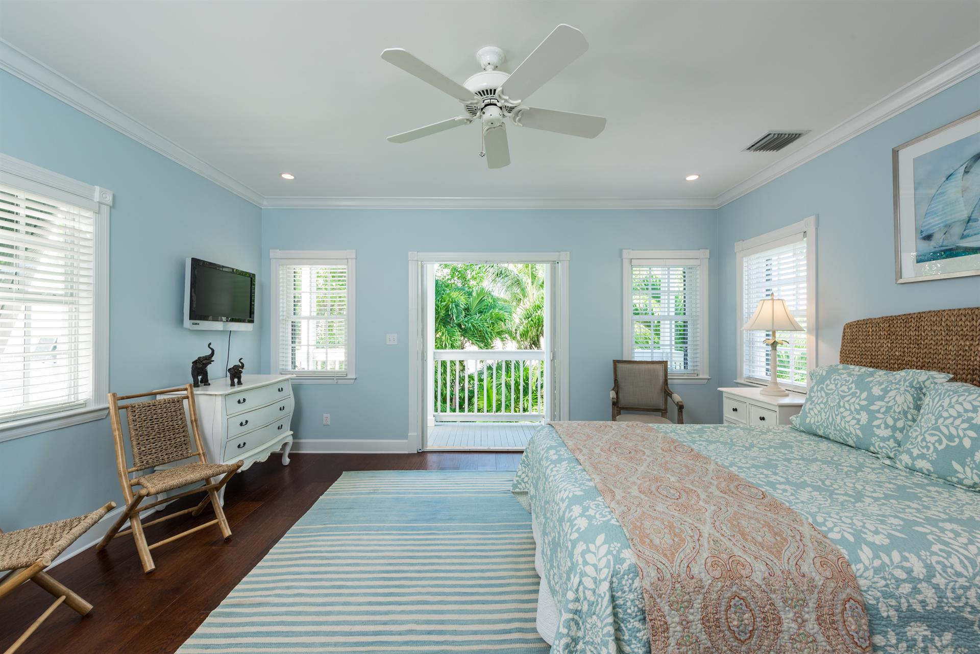 Queen bedroom has private balcony and ensuite bath.