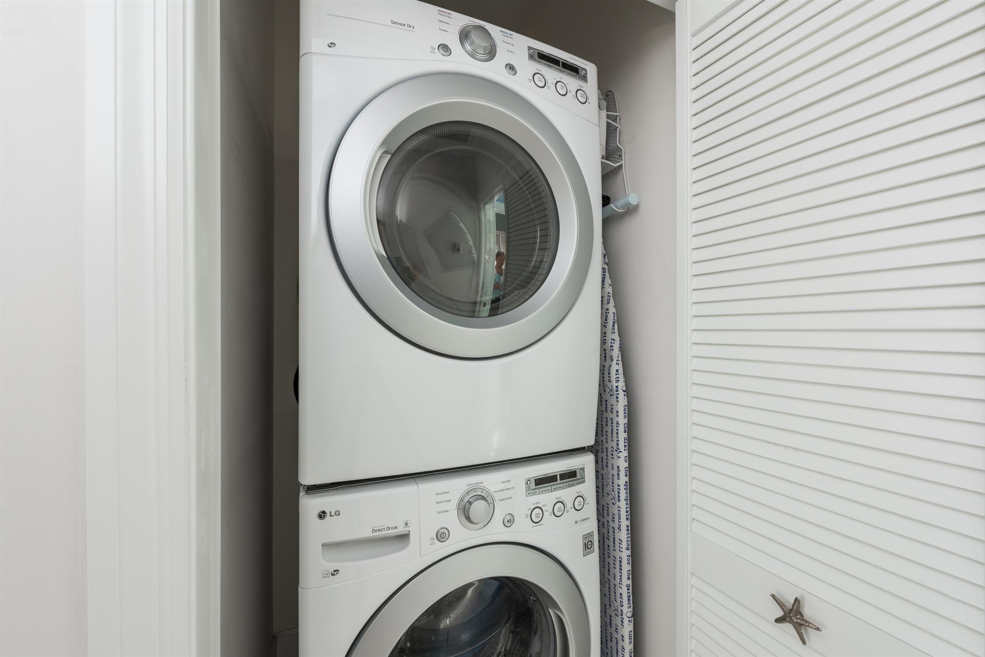 Stacked washer and dryer for your use.