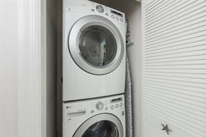 Stacked washer and dryer for your use.