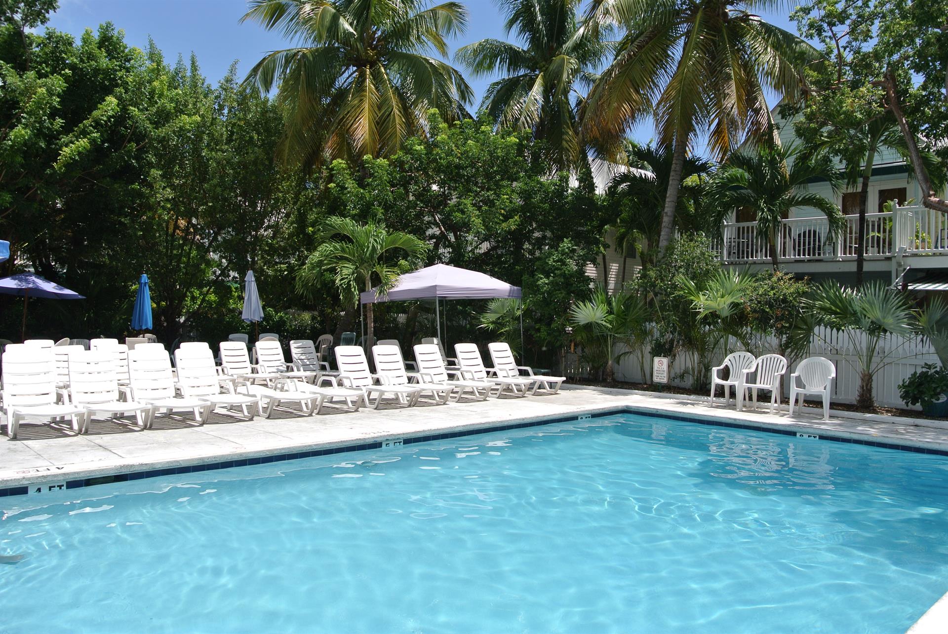 Pool area with plenty of seating and sunshine