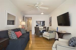 Living room area includes beautiful furnishings and HDTV.