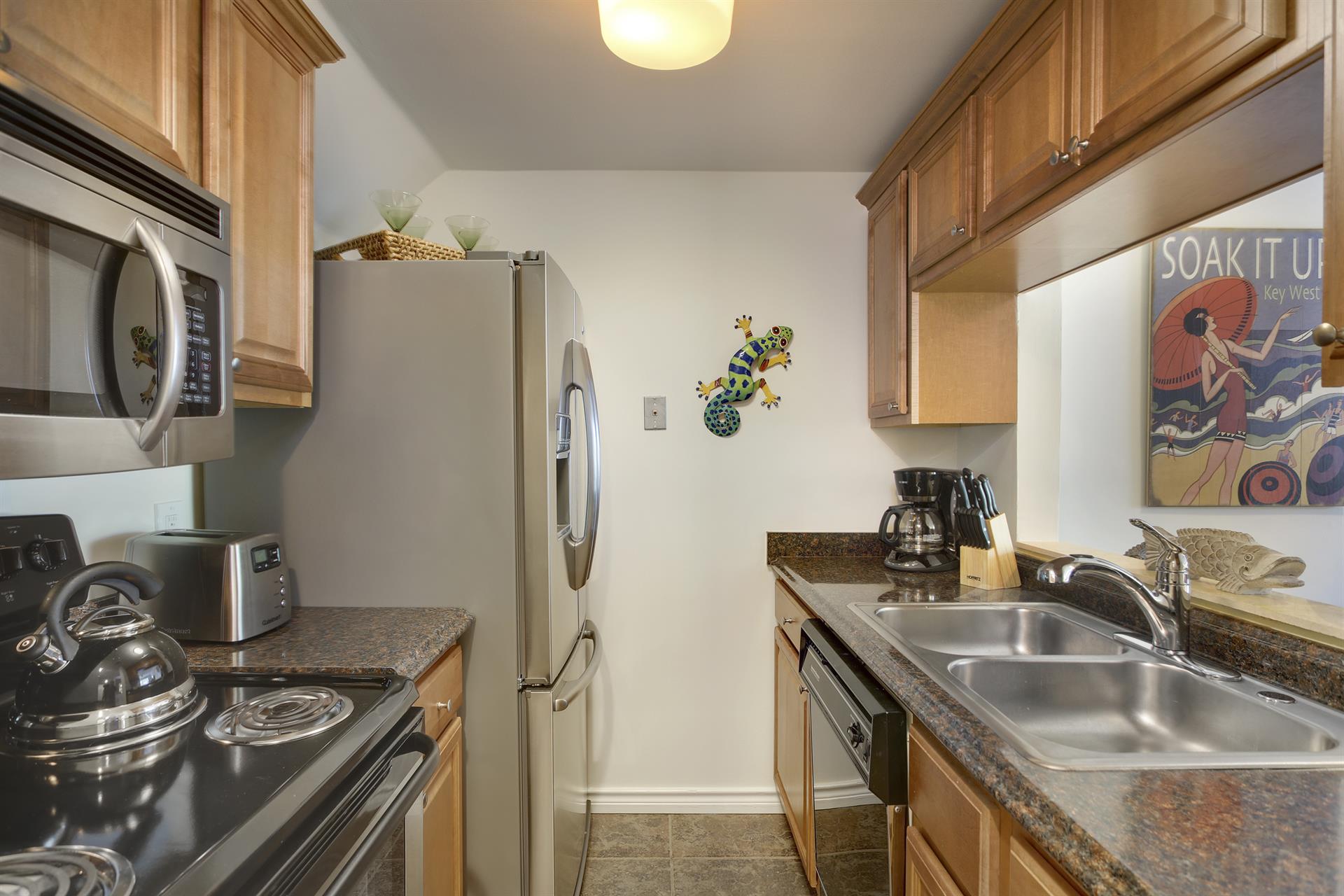 Updated kitchen with stainless steel appliances.
