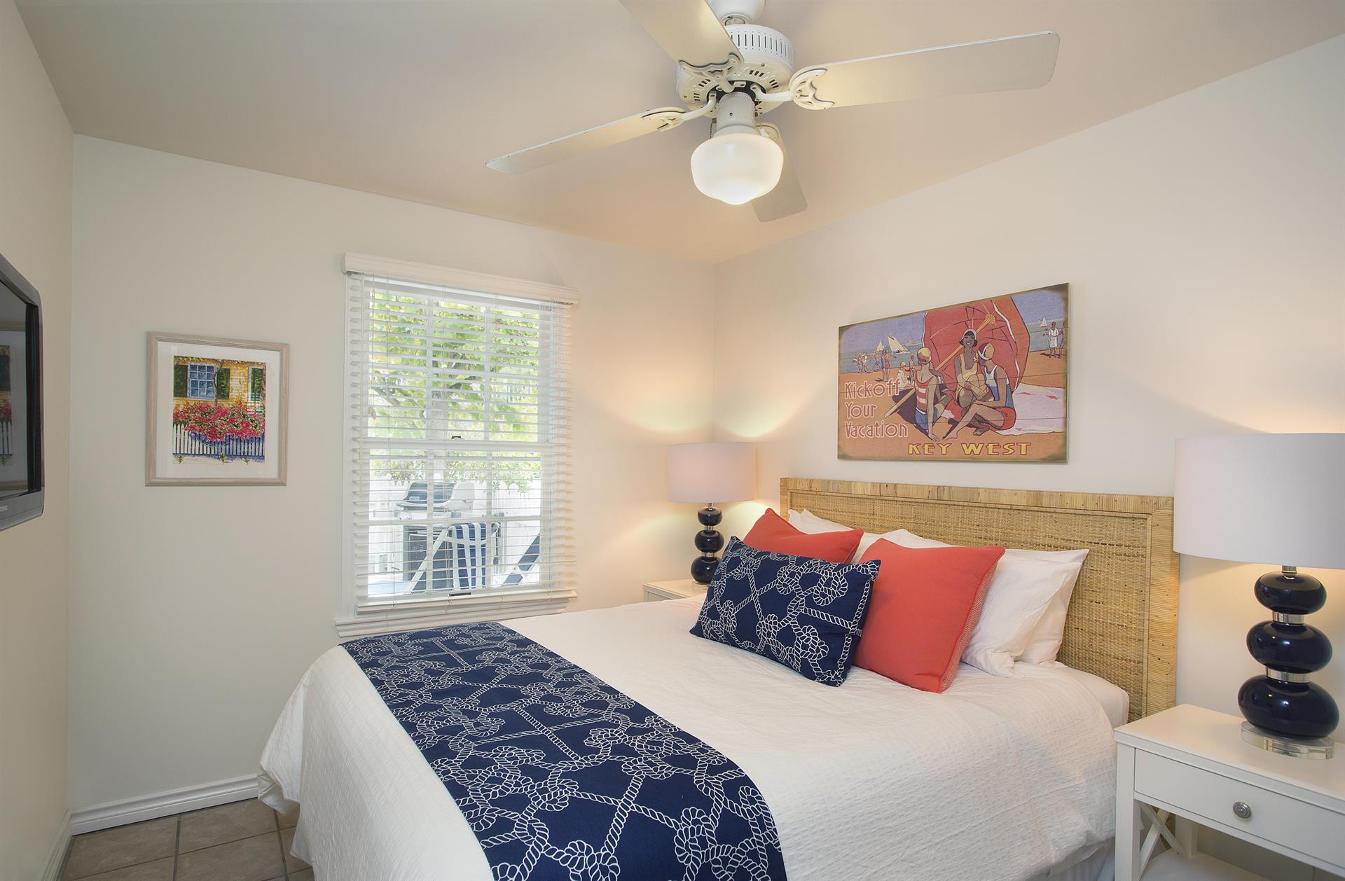 HDTV and cozy queen bed with crisp fresh linens.