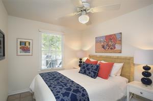 HDTV and cozy queen bed with crisp fresh linens.