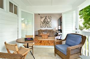 Gorgeous breezy balcony flows from the living room.