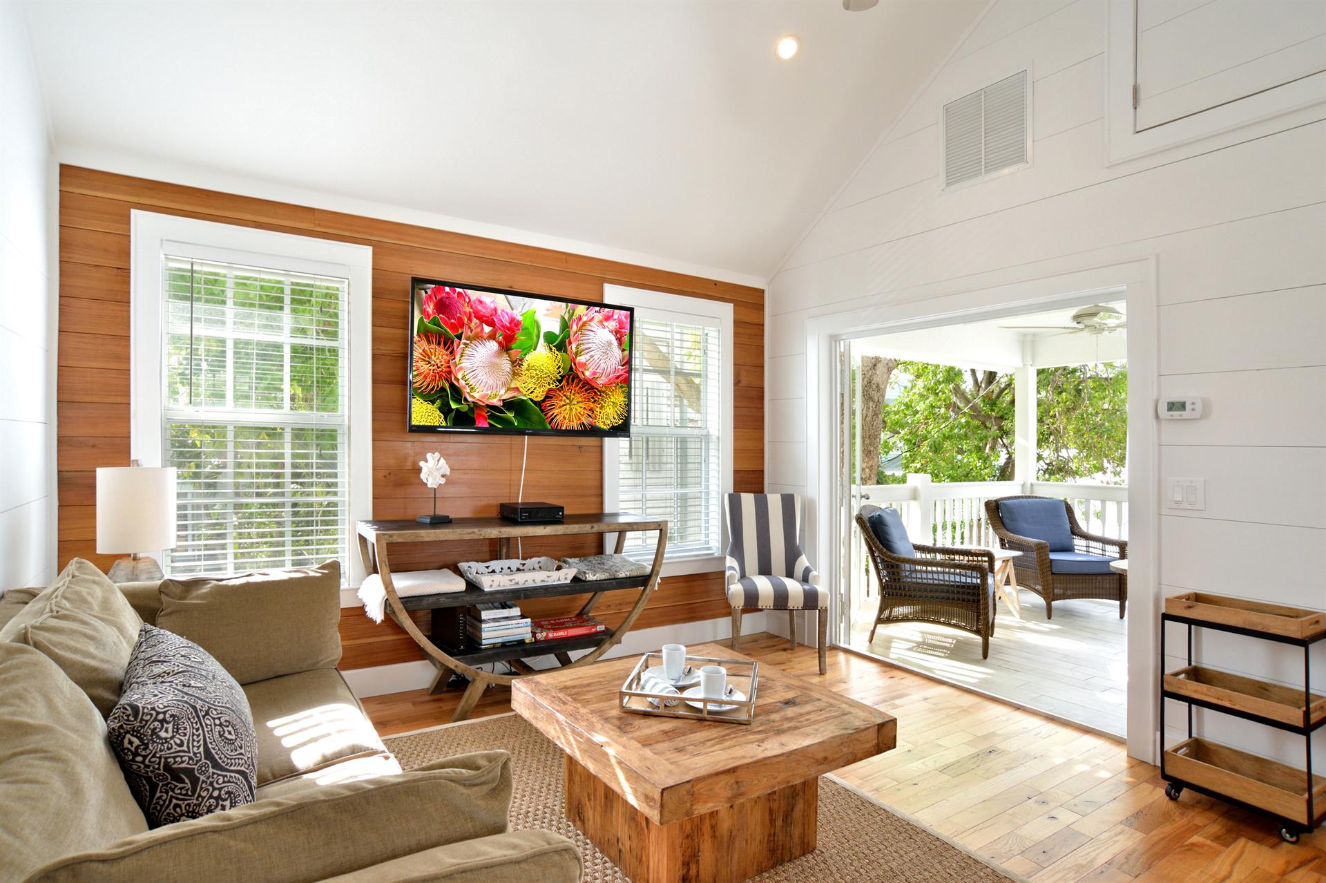 Beautiful living room w vaulted ceilings  large TV.