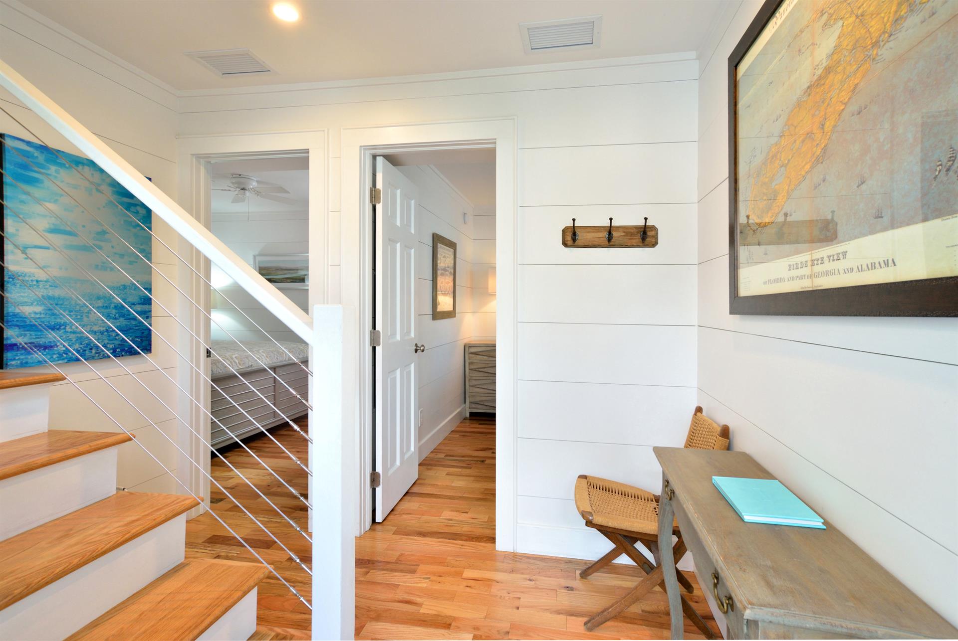 First floor hallway and access to both bedrooms.
