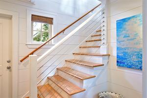 Stairs leading up to living area and kitchen.