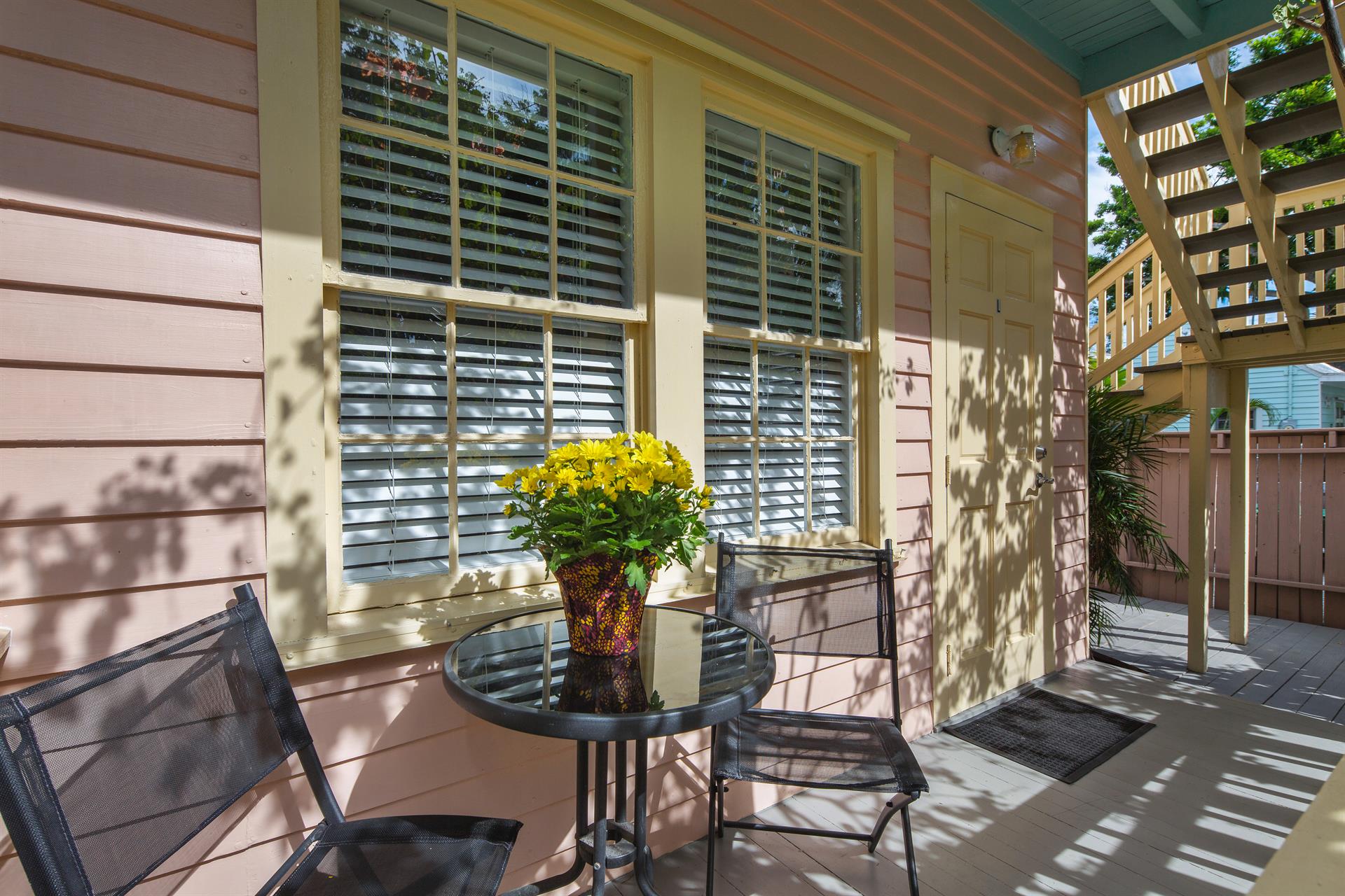 Front porch and entrance to Poinciana Garden.