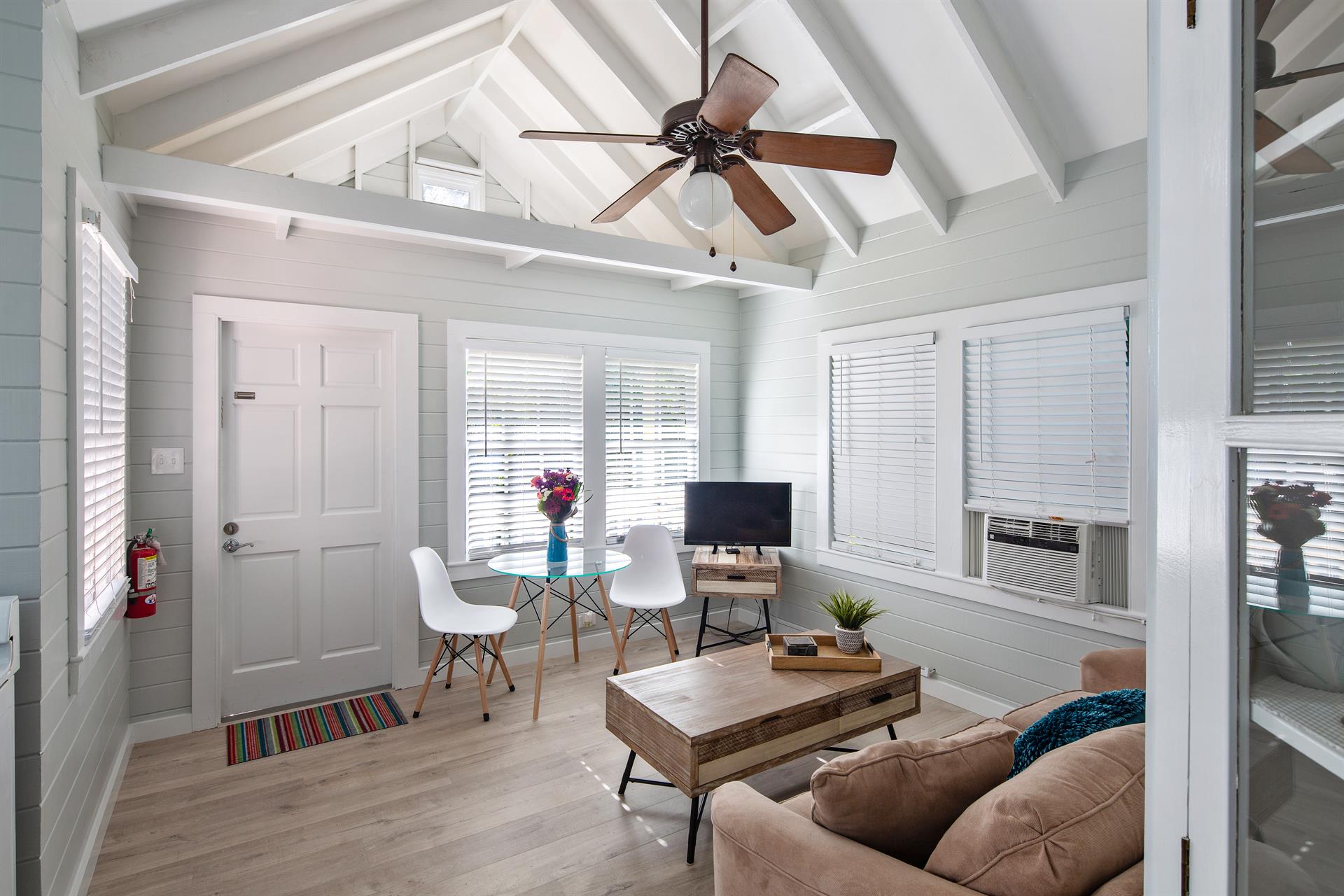 Living room of Poinciana Treetop, with vaulted ceilings.