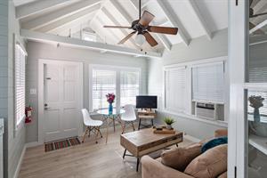 Living room of Poinciana Treetop, with vaulted ceilings.