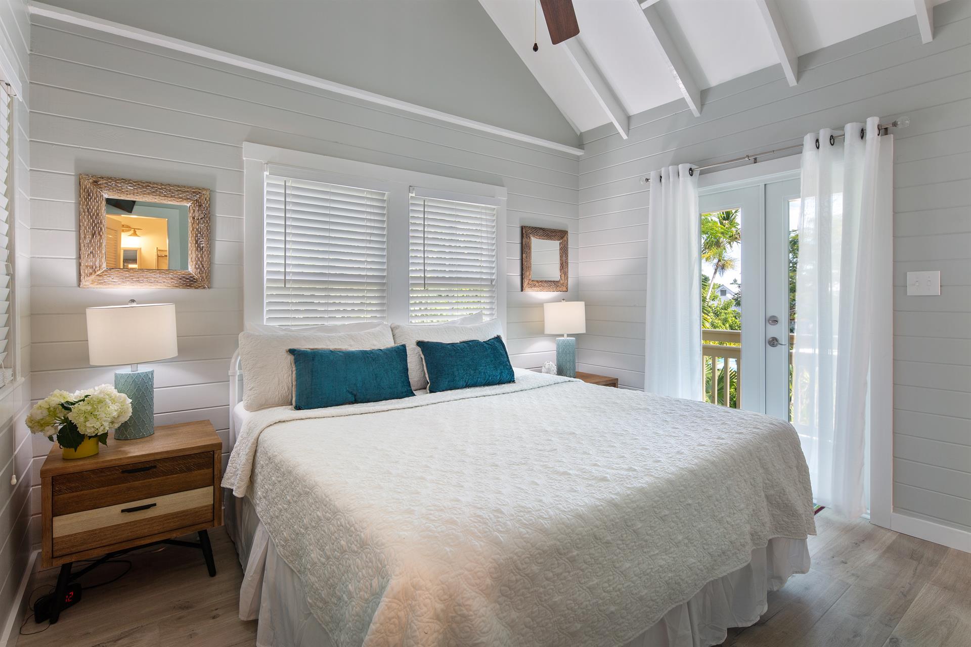King bedroom upstairs with balcony and ensuite bath.